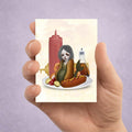 Illustration of a mermaid in an hot dog bun on an ACEO card held by a hand against a light purple background