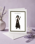 Sagittarius zodiac birthday card featuring an illustration of a short-haired maiden archer with an eyepatch, holding a bow and arrow quiver.