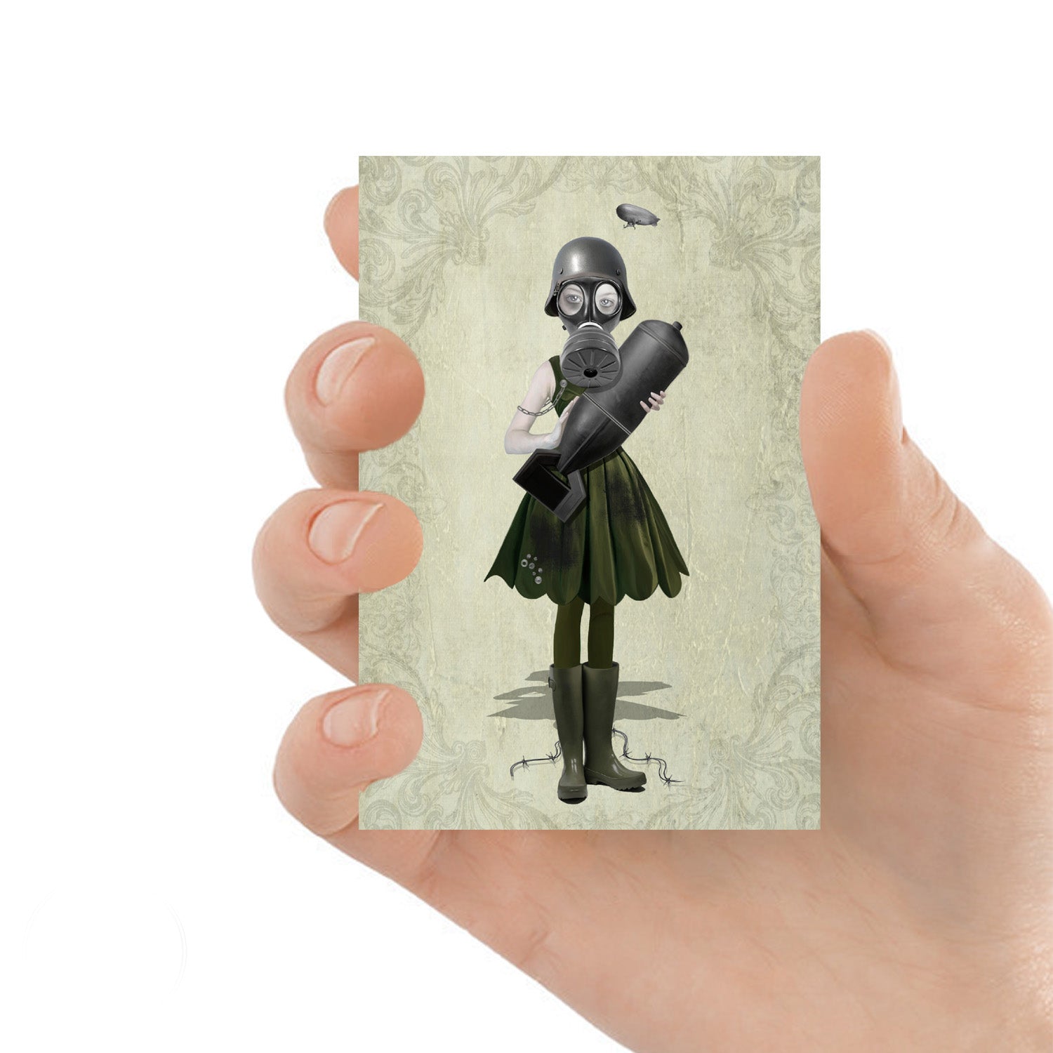 ACEO art card featuring a soldier girl and bomb, held in hand— dystopian art style with  whimsical elements.