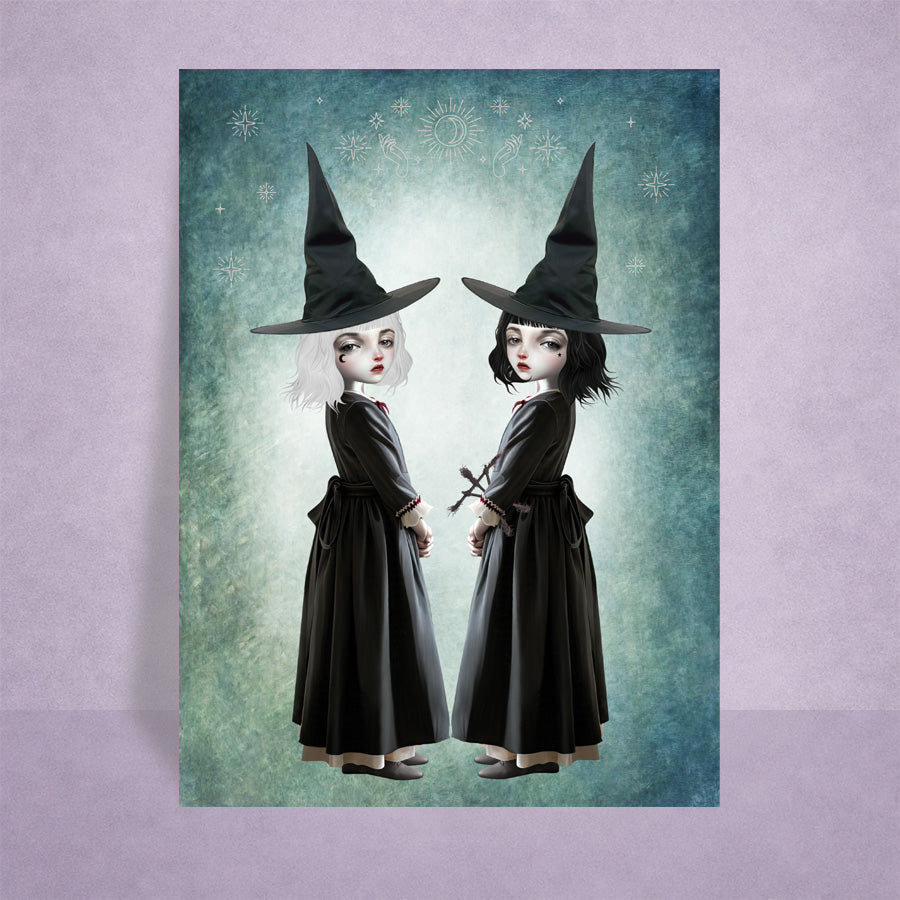Miniature 2.5x3.5 ACEO art card on display, featuring twin gothic witches with white and black hair against a celestial teal background.