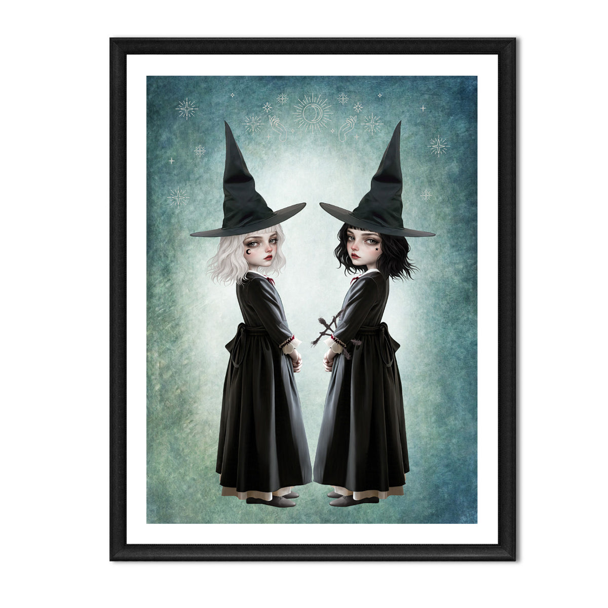 Dark cottagecore fine art print in an A4 Frame featuring twin gothic witches with white and black hair wearing pointed hats, set against a celestial teal background.