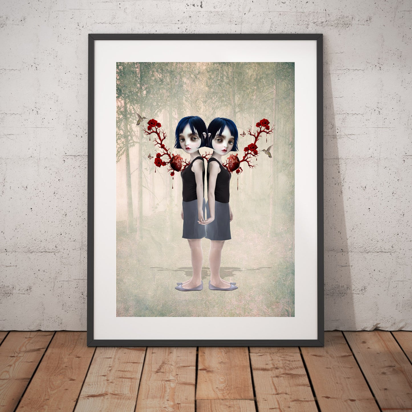 Sisters Art Print in a frame against white wall.