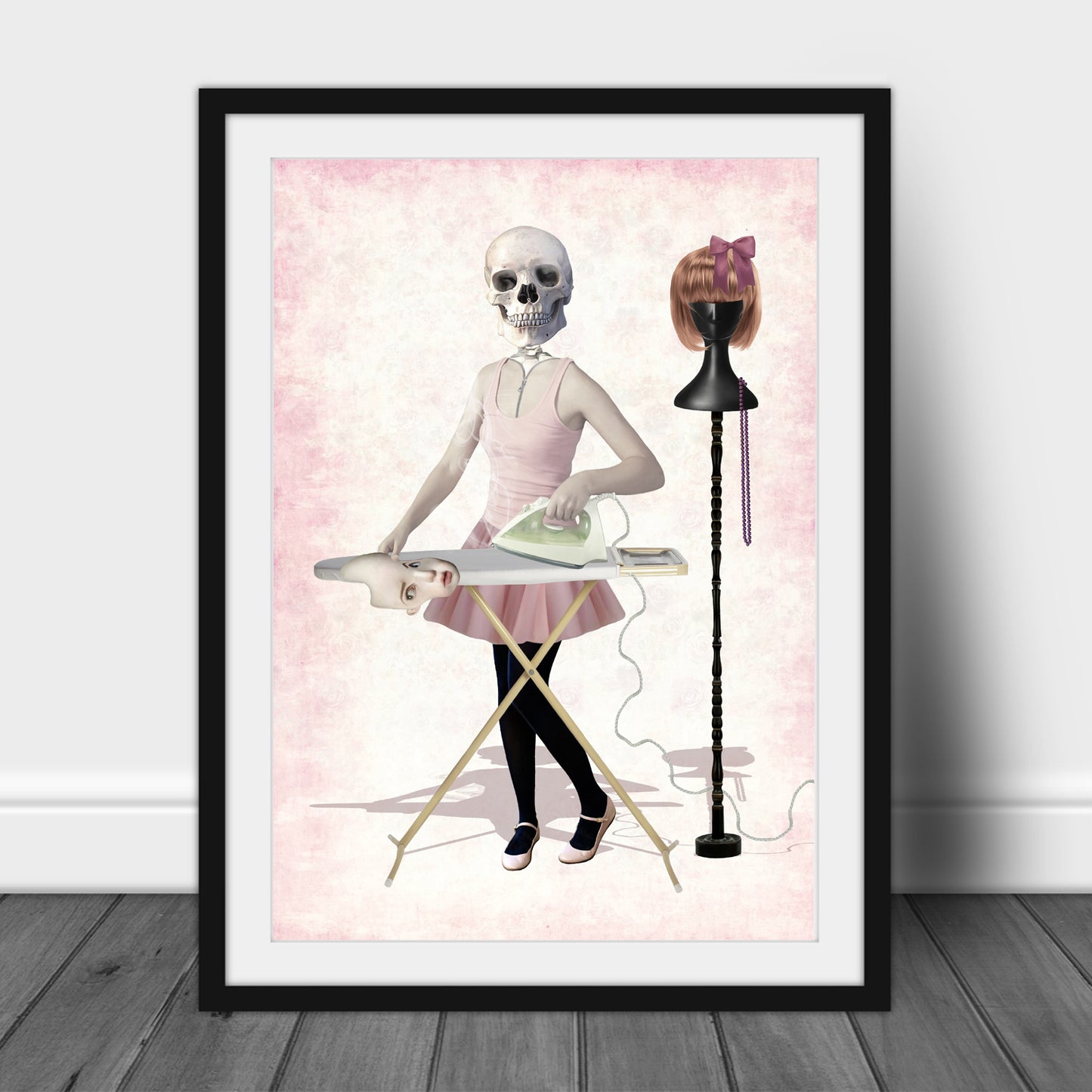 Quirky Art print of a skeleton girl, in a frame, leaned against a wall.