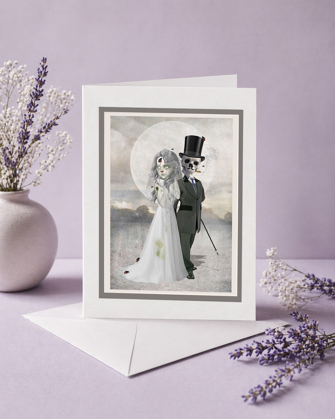 Gothic wedding greeting card features a skeleton groom and zombie bride.