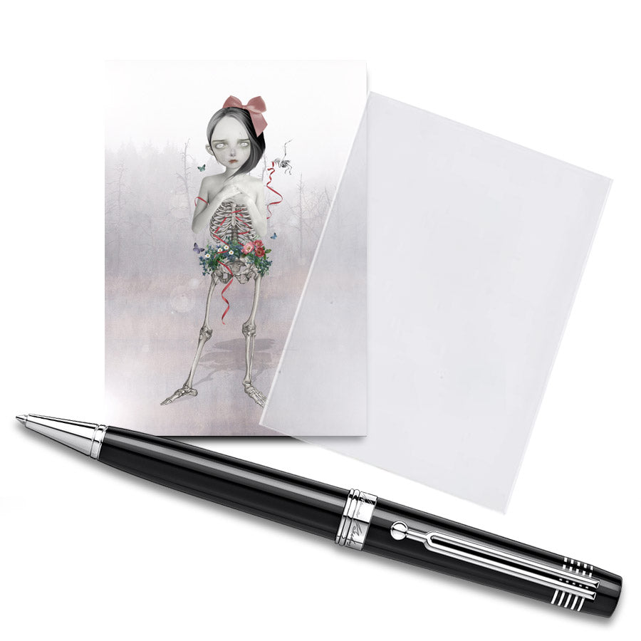 memento mori collectible art showcases a unique half human half skeletal girl with wild flowers growing around her pelvis.&nbsp;