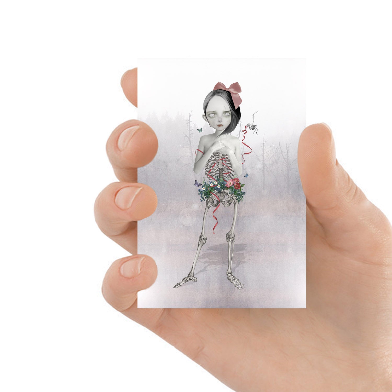 Skeleton Girl ACEO Trading Card. This miniature memento mori collectible art showcases a unique half human half skeletal girl with wild flowers growing around her pelvis.