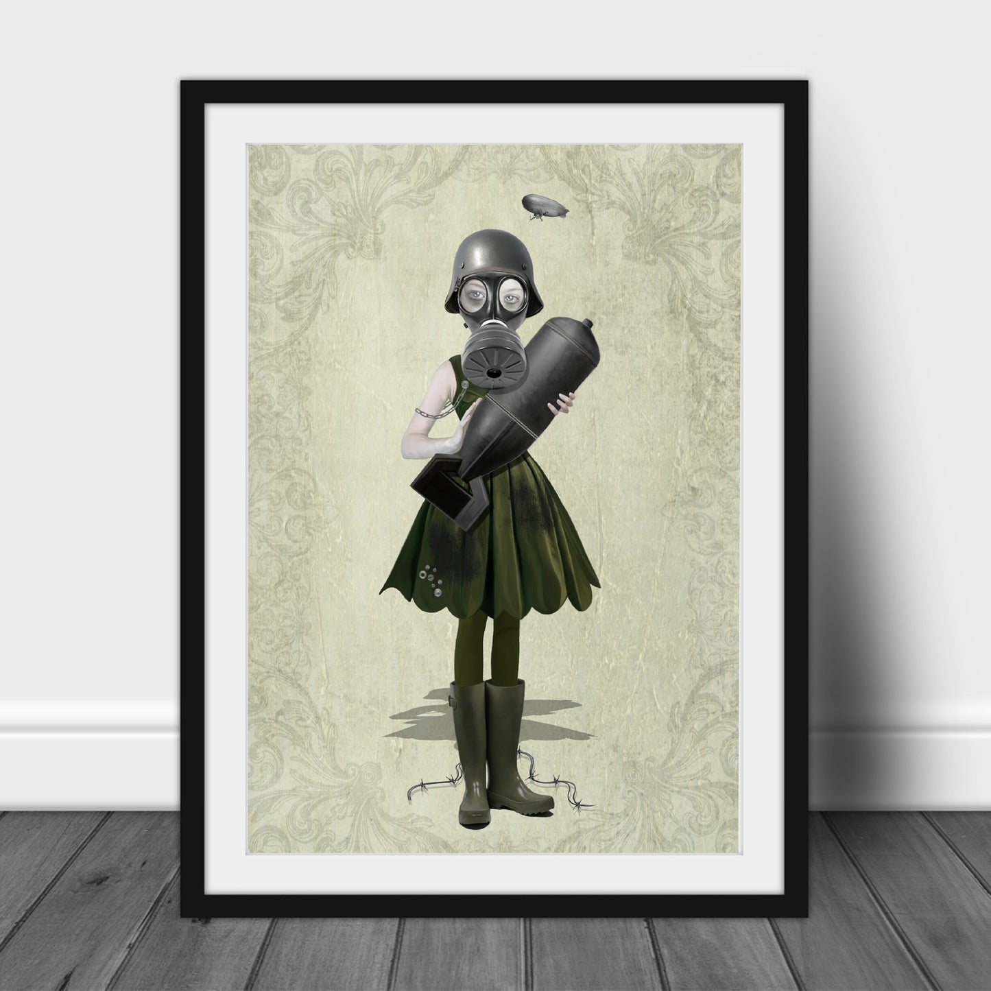 Art print of a soldier girl and bomb, in a frame, leaned against a wall.
