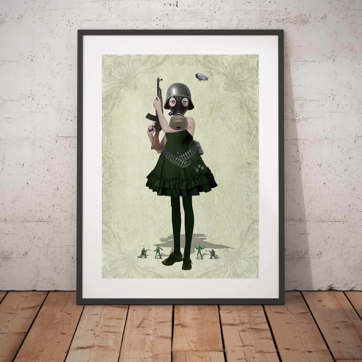 Art print of a soldier girl and toy soldiers, in a frame, leaned against a wall.
