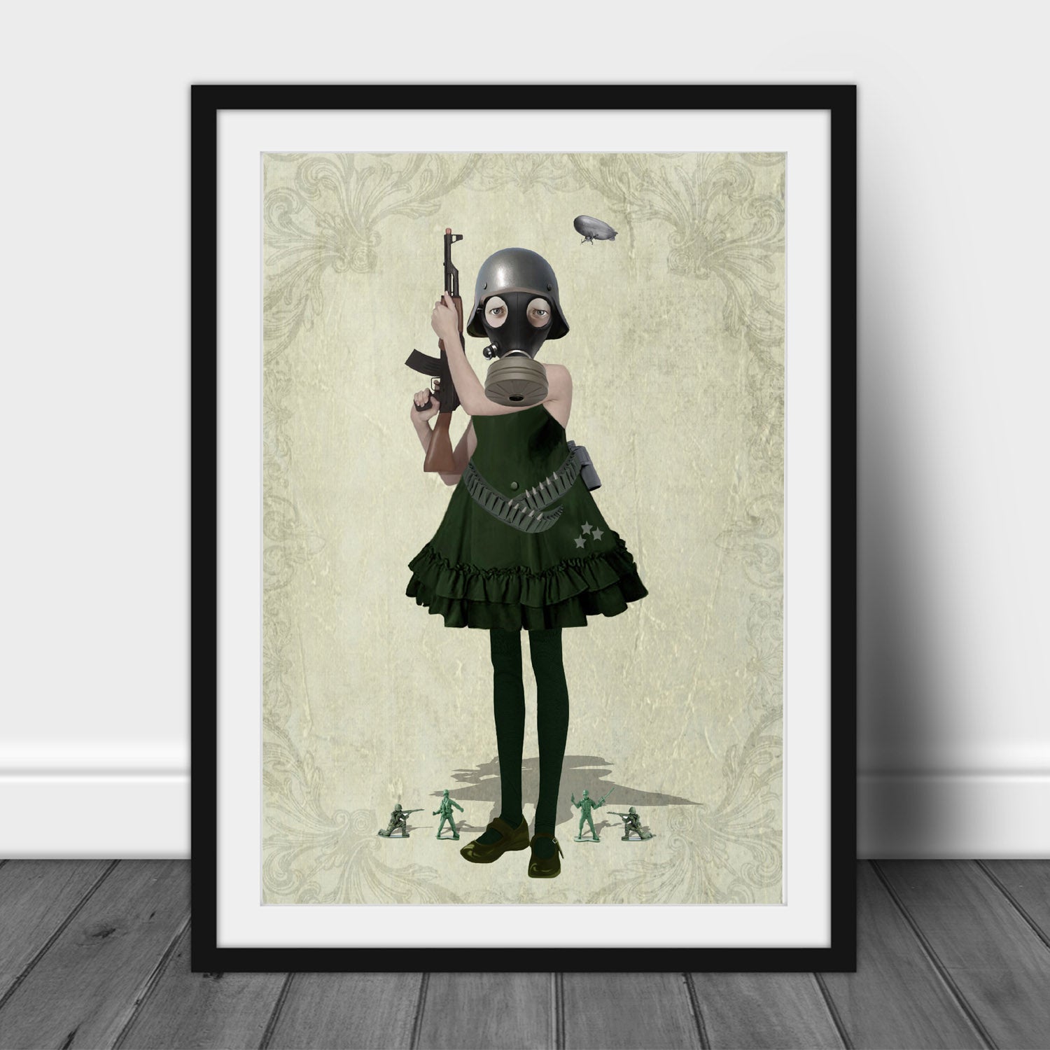Soldier Girl And Toy Soldiers art print in a black frame, standing against a white wall."