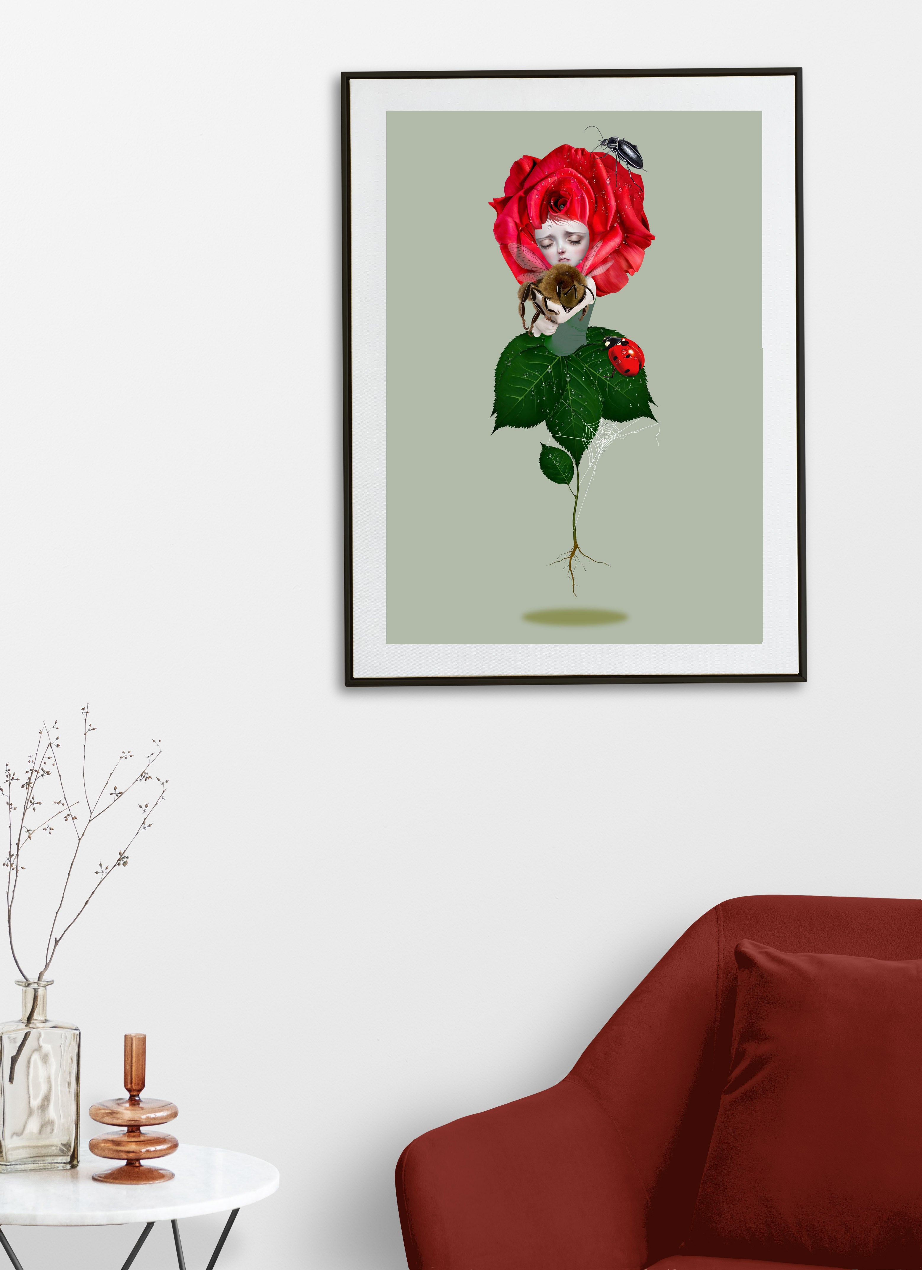 Framed art print on display on a living room wall, illustration is a bee emerging from the heart of a vibrant red rose, surrounded by enchanting garden companions including a bee, ladybird, beetle, and intricate spider's web.