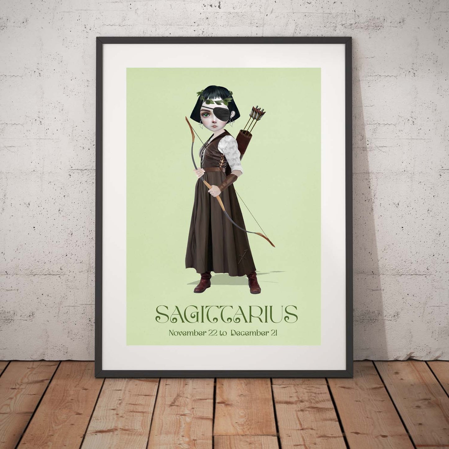Sagittarius Girl art print in a black frame, standing against a white wall.