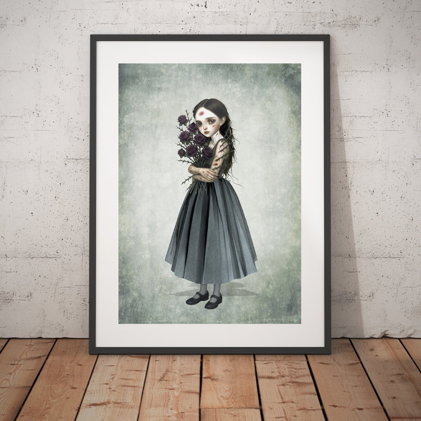 Surreal art print of a girl with a thorny rose bouquet, framed in black and displayed against a white brick wall.