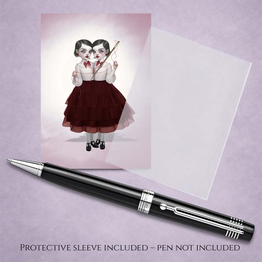 Collectible creepy cute ACEO art print with protective sleeve featuring a dark surrealism illustration of conjoined twins sewing.