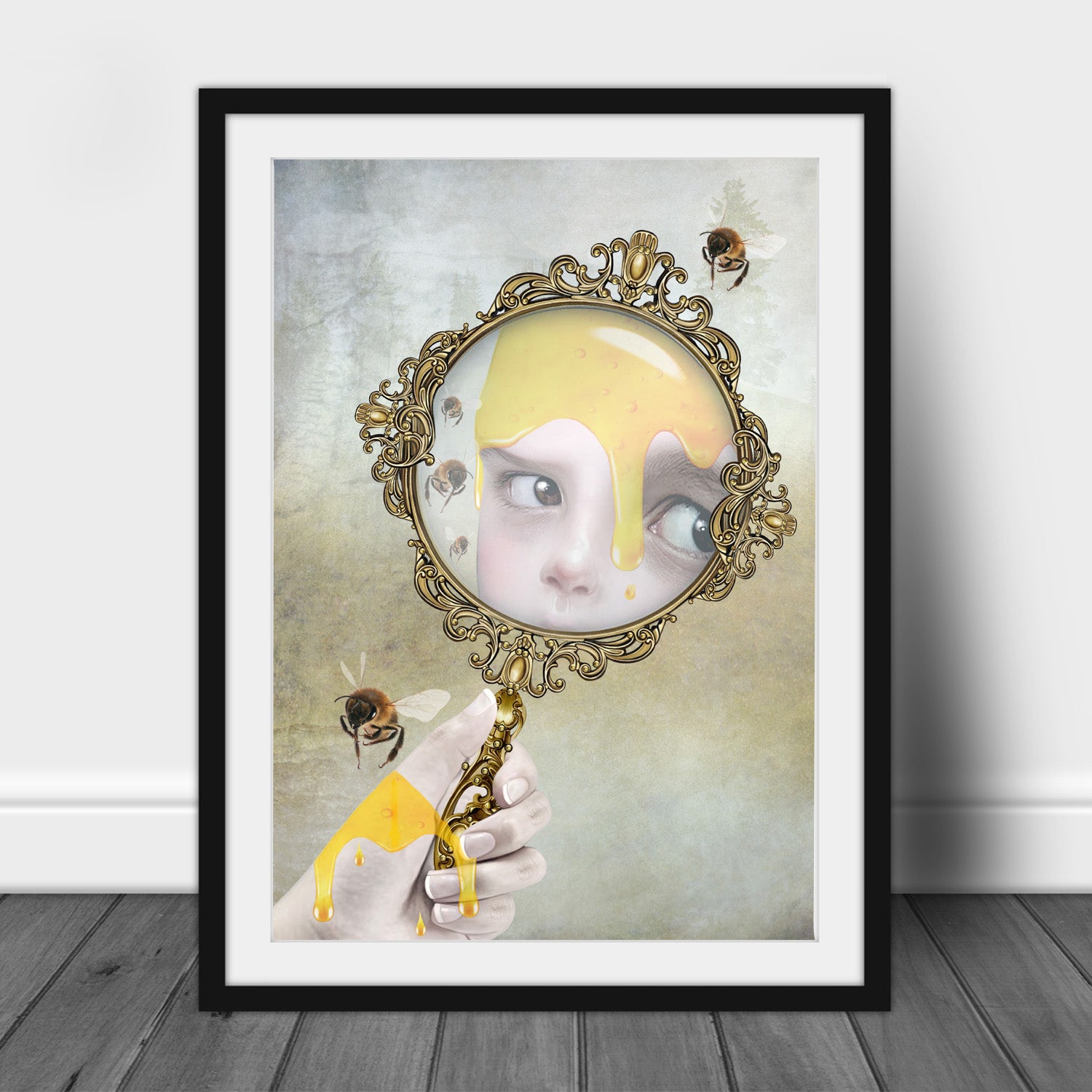 Surreal Honey Bee Art Print in a back frame for display.