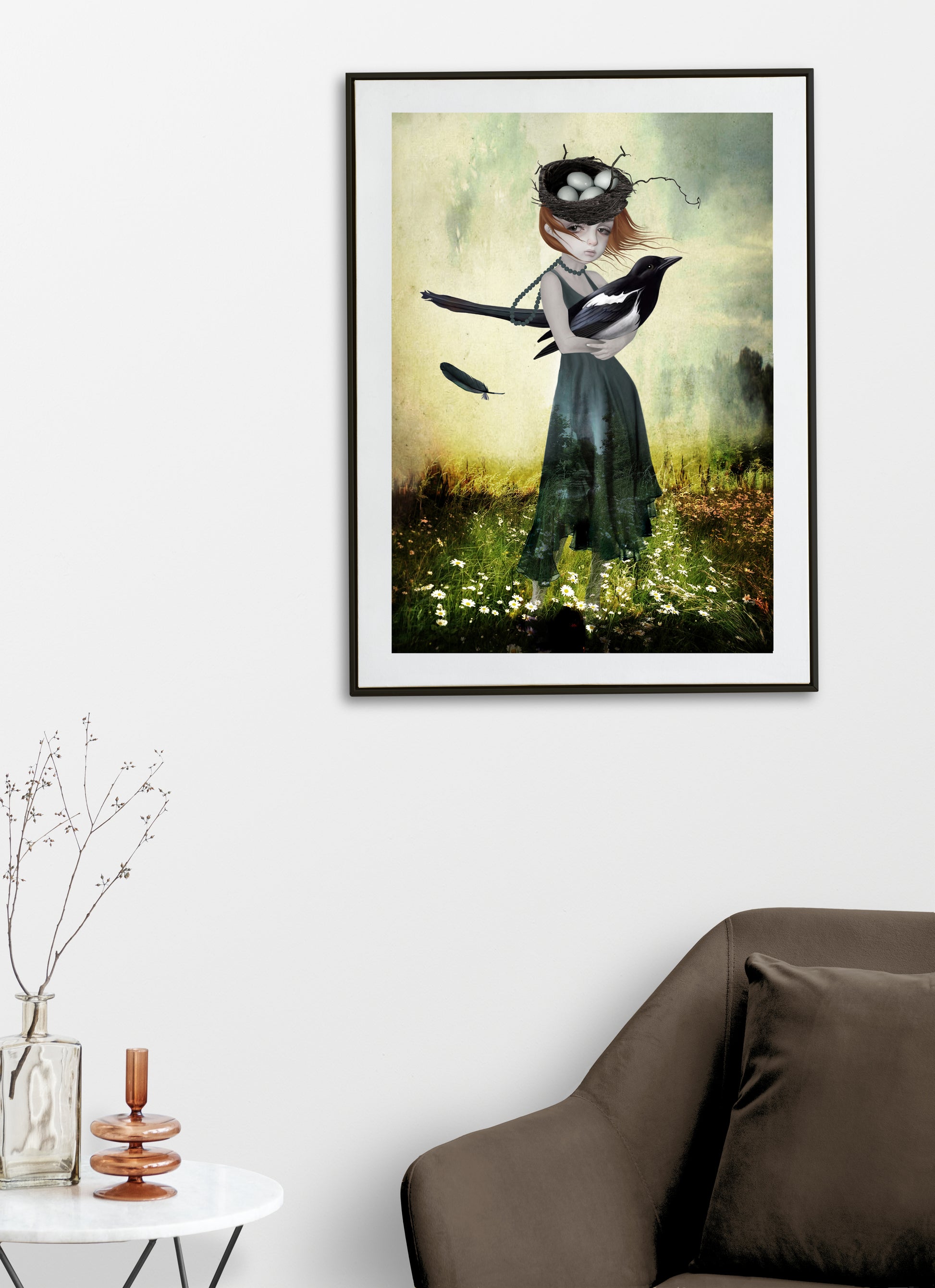 Surreal art print, a girl holding an oversized magpie in a field of flowers on a living room wall.