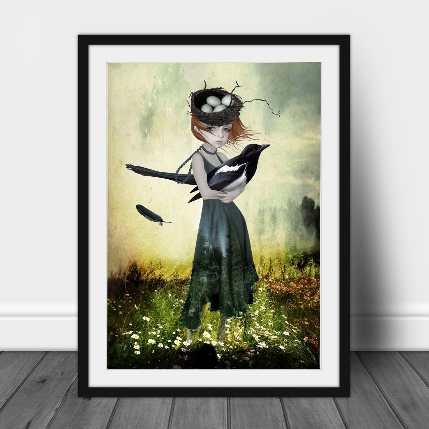 Surreal magpie wall art print image is a  girl holding an oversized magpie in a field of flowers.