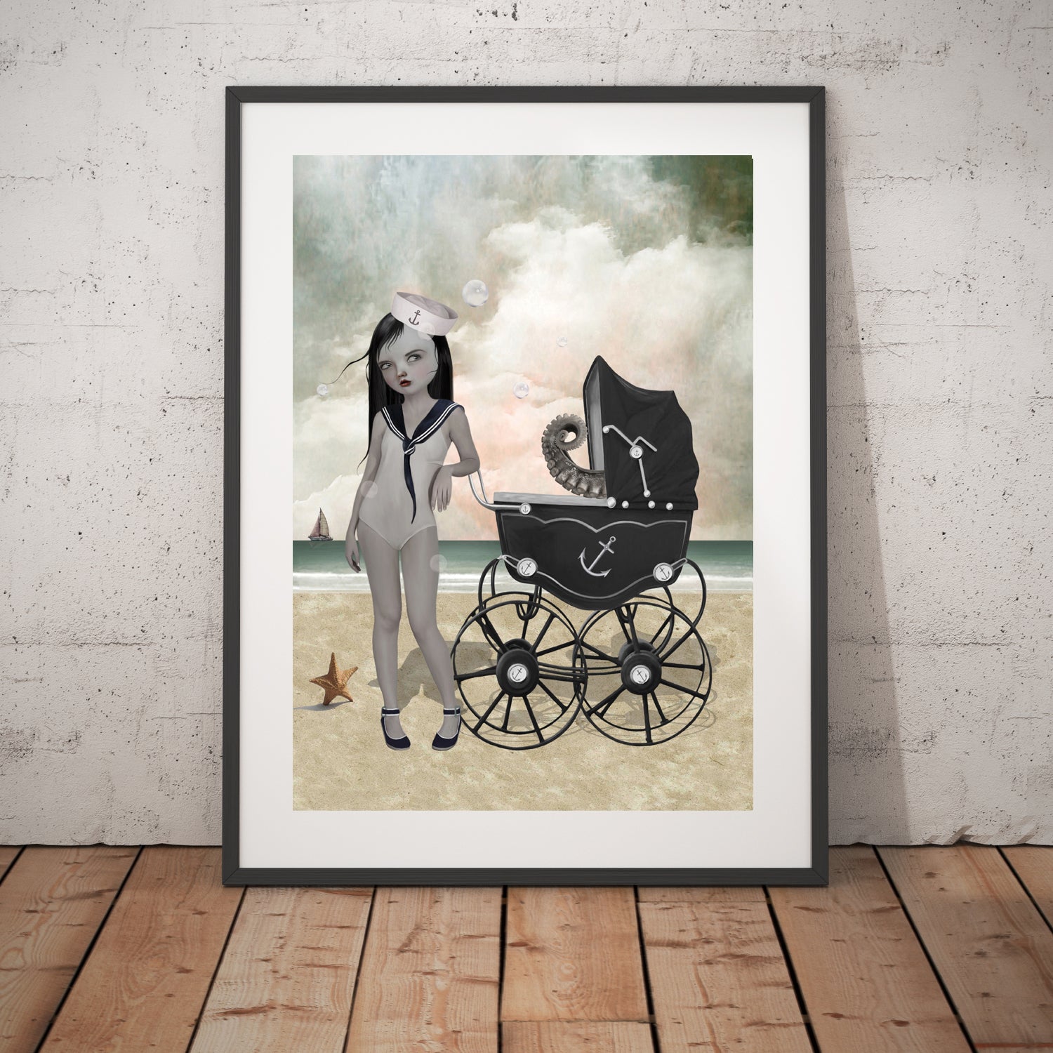 Surreal Nautical art print in a black frame, standing against a white wall.