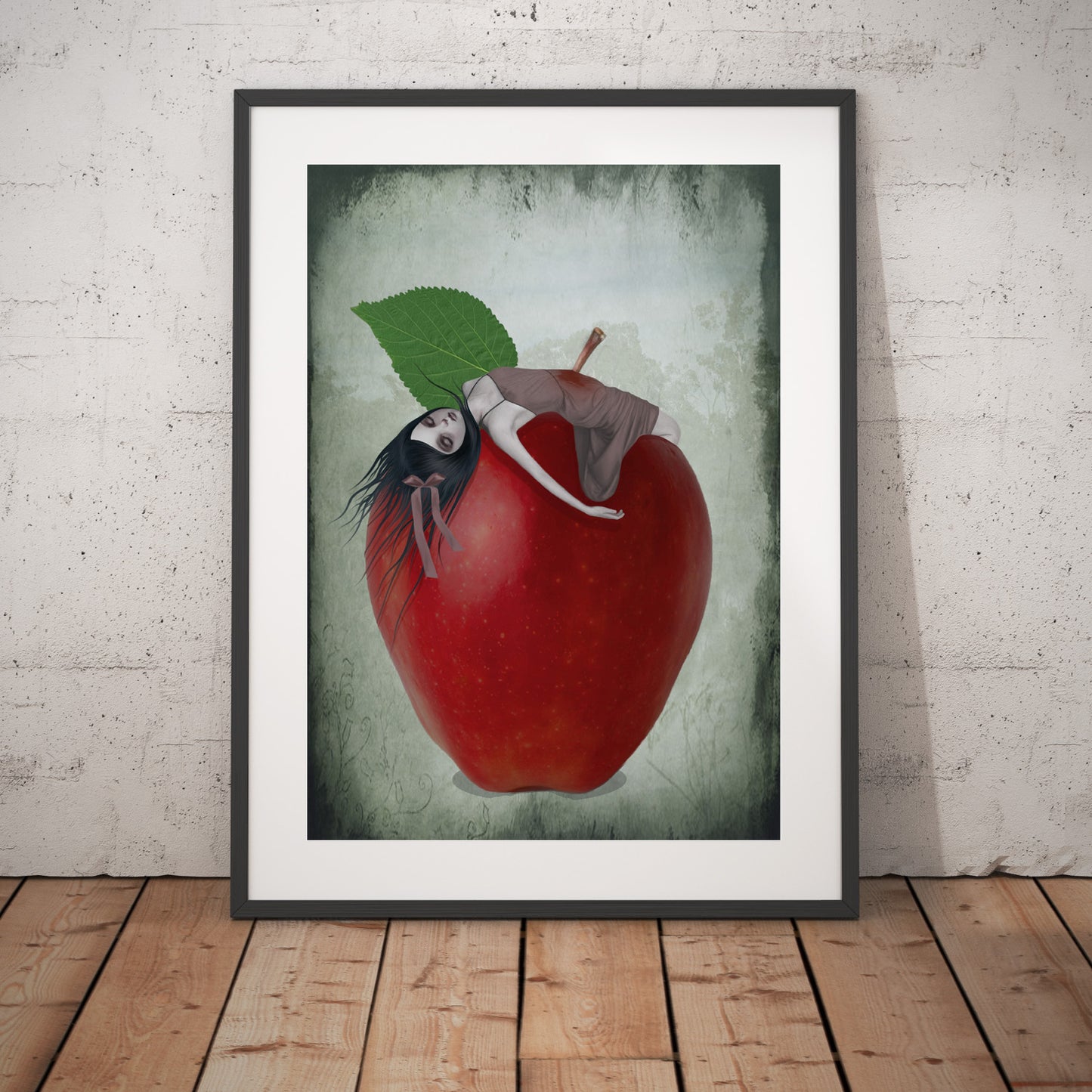 Surreal Red Apple Art Print leaning on a white wall.