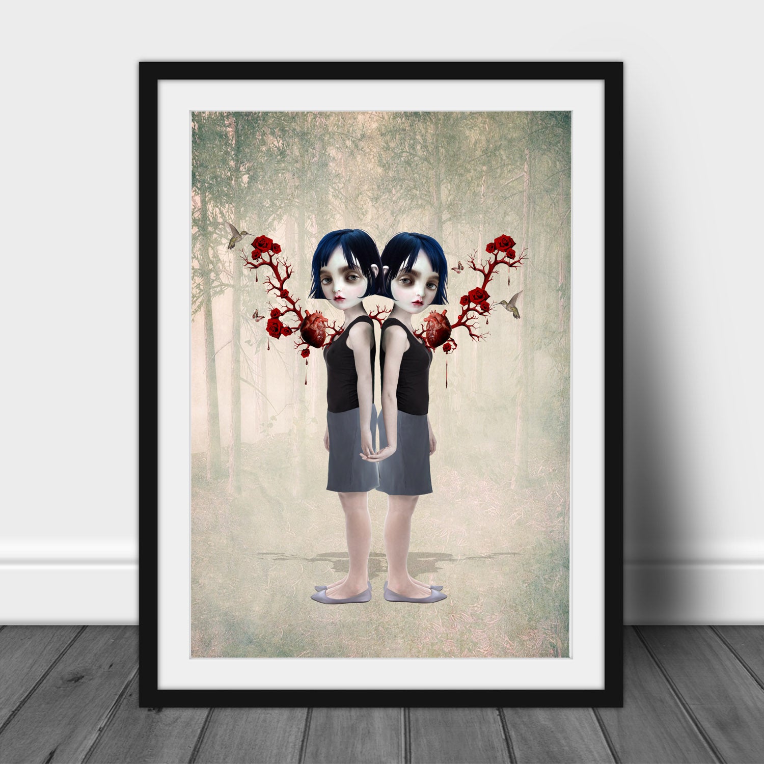 Framed artwork of twin girls bound by anatomical hearts and roses.