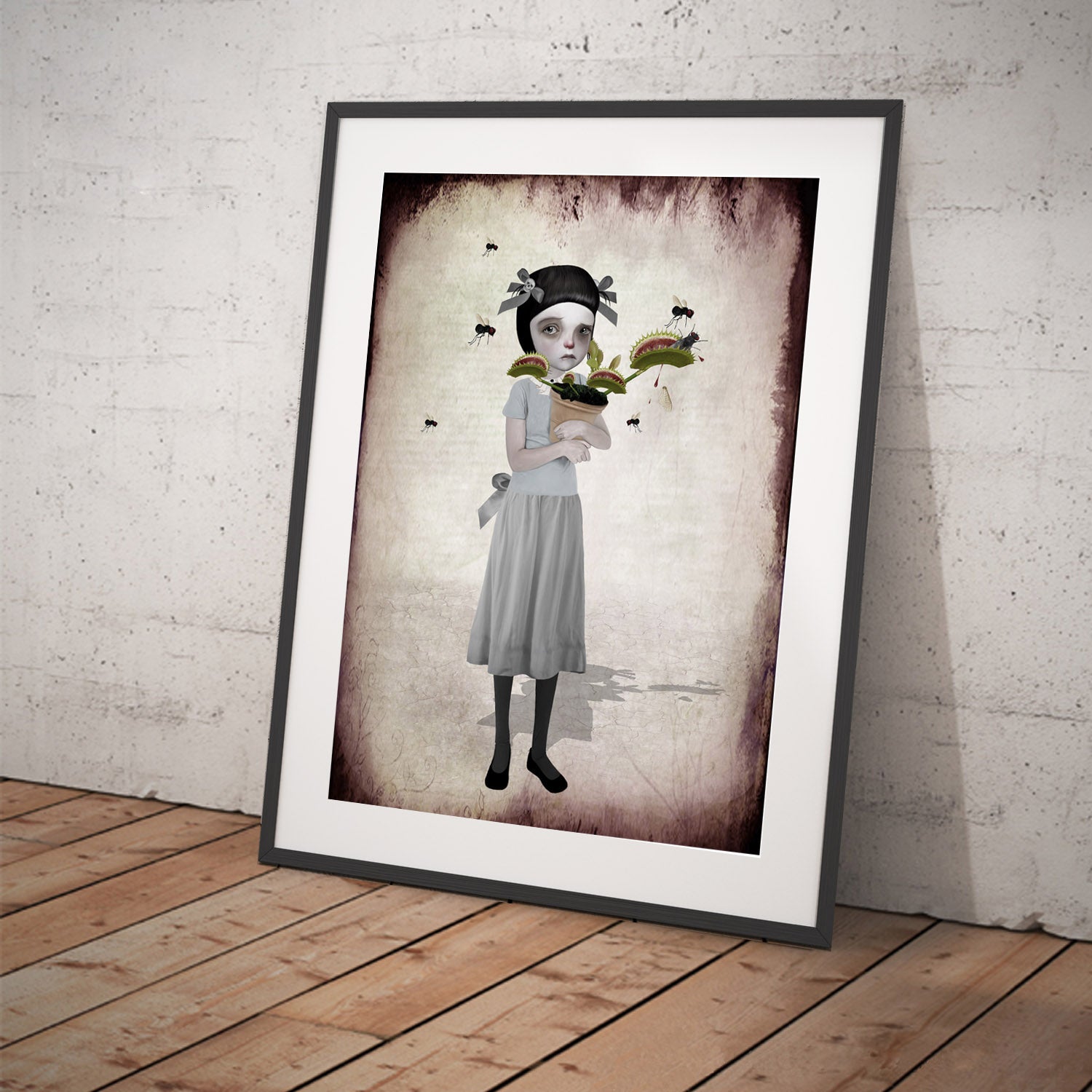 Carnivorous plant framed Art Print features a tearful girl holding her Venus Flytrap as it chomps on flies.