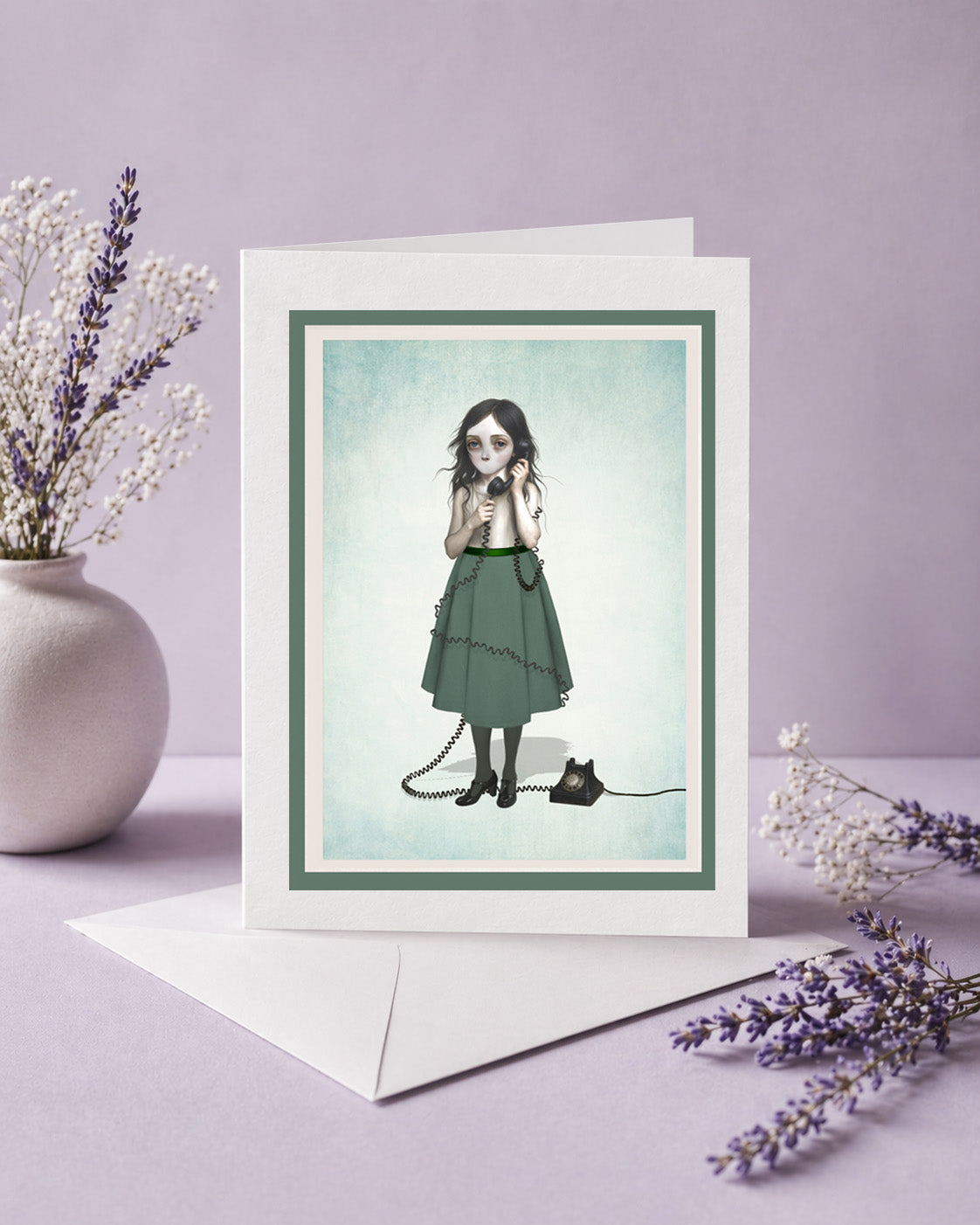 Greeting card with illustration of a woman on the phone with no mouth, surrounded by lavender flowers on a purple background.