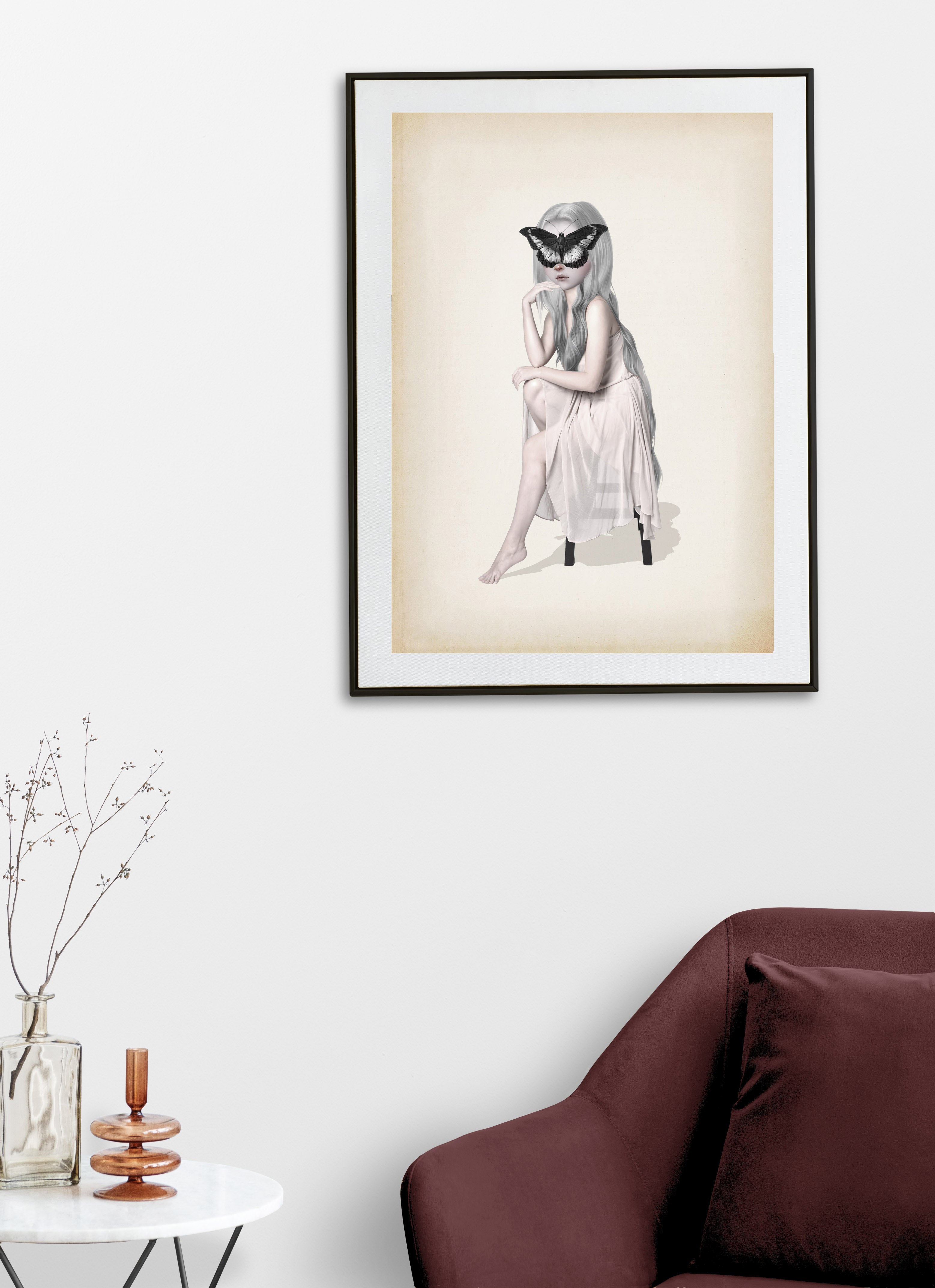 Surreal art print of a girl with long white hair in a pale pink dress with a black butterfly covering her eyes art print on wall.