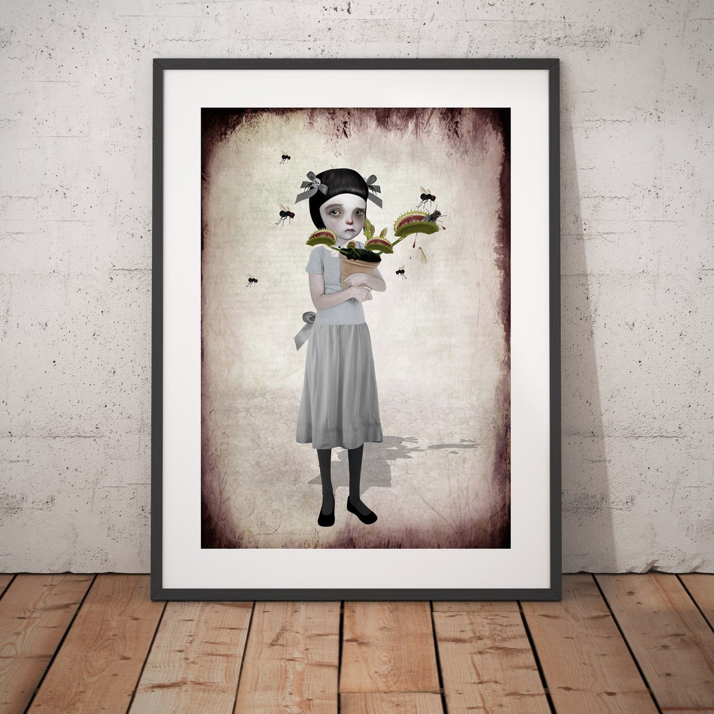 Surreal framed Art Print features a tearful girl holding her Venus Flytrap as it chomps on flies.