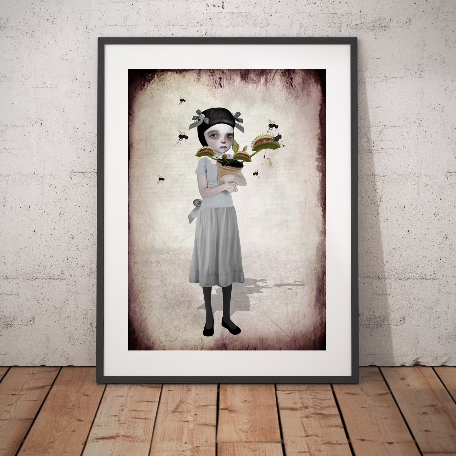 Surreal framed Art Print features a tearful girl holding her Venus Flytrap as it chomps on flies.