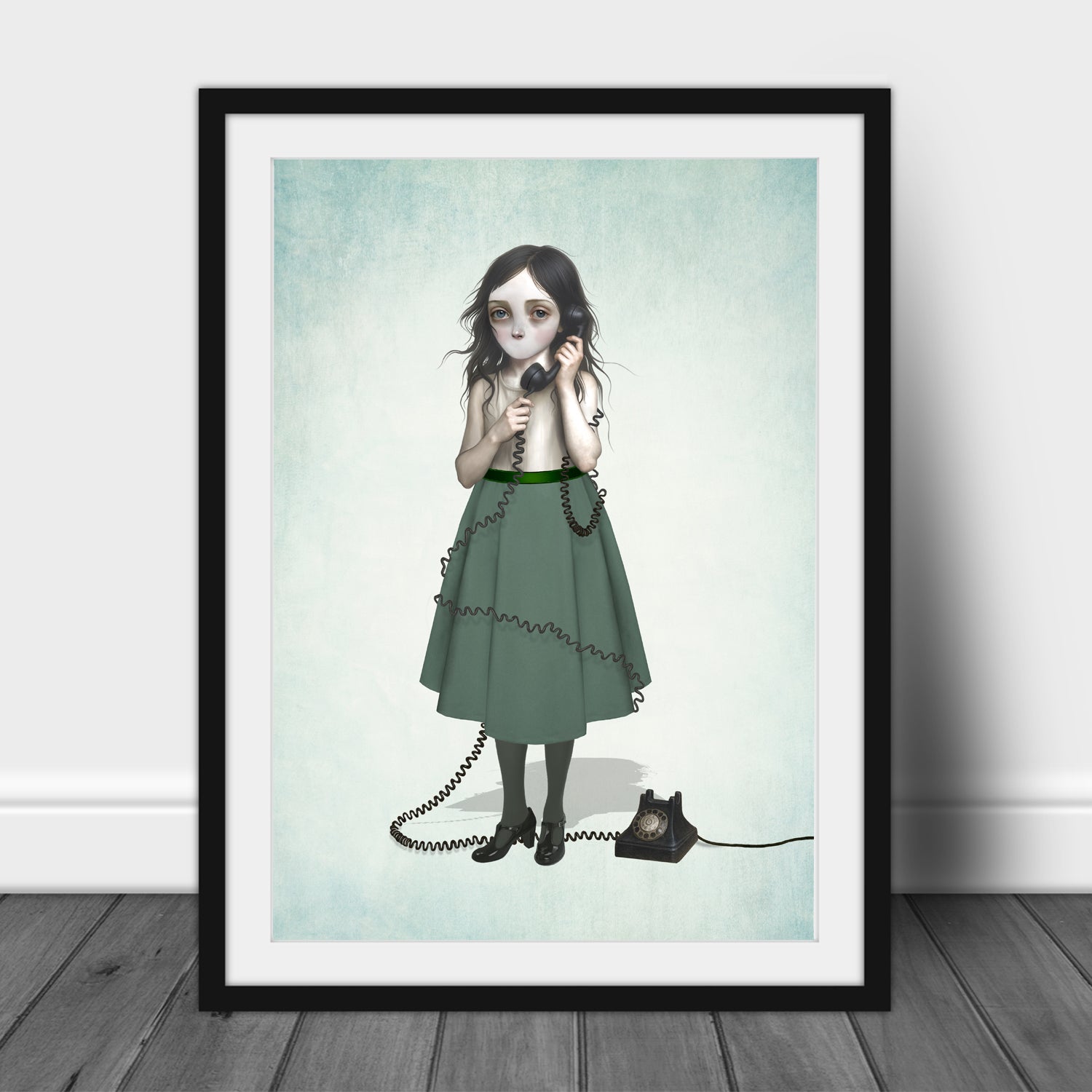 Framed artwork of a girl with no mouth in a green dress holding a phone on a light blue background