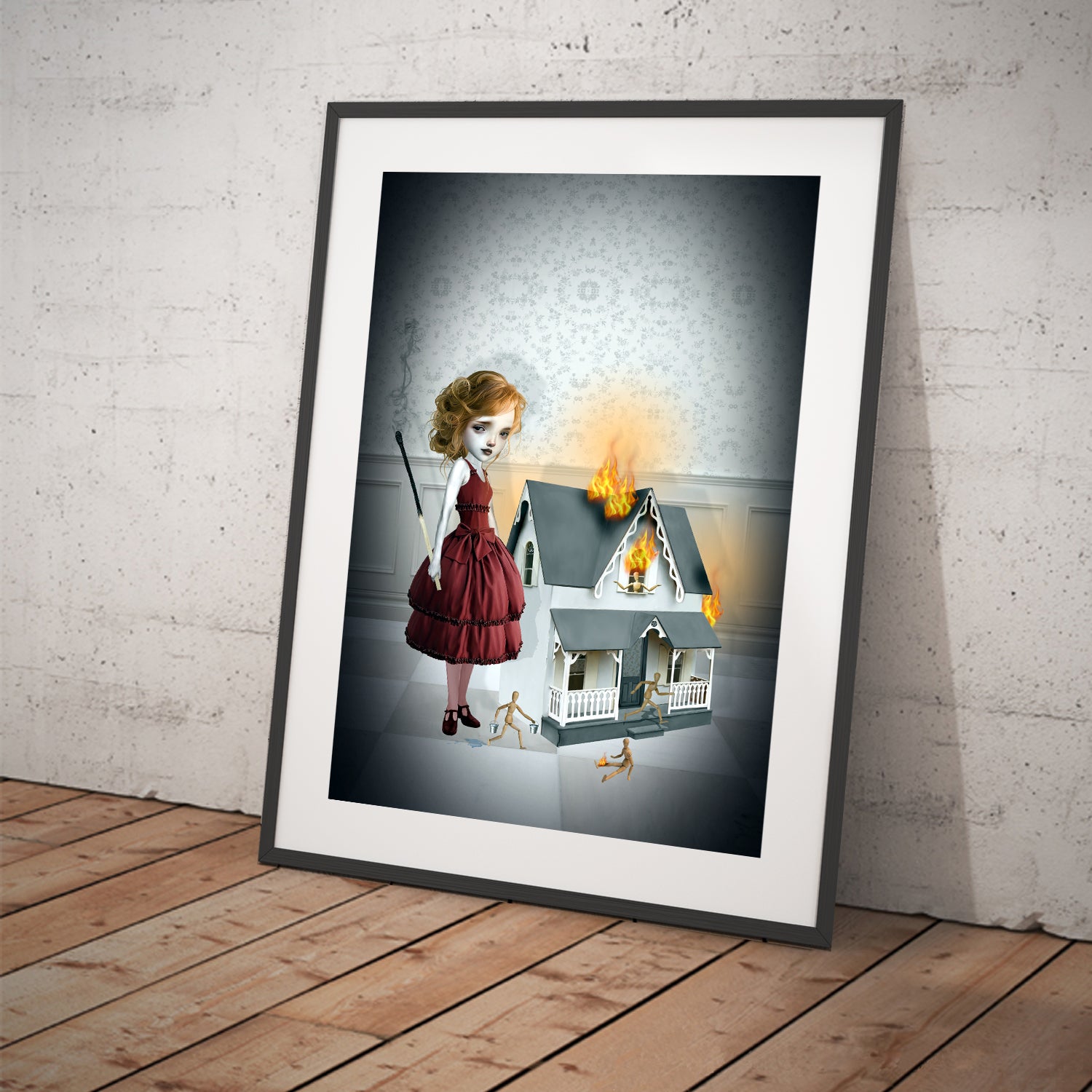 creepy cute surreal art print features a girl standing beside a burning dollhouse, clutching an oversized burnt match. As wooden dolls scatter.