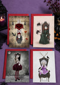 Set of 4 glossy 5x7 gothic vampire girl alternative Halloween cards displayed with bold red envelopes.