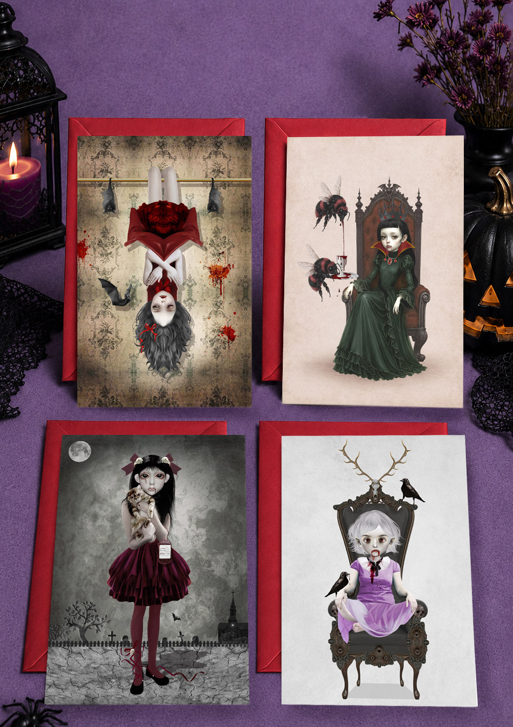 Set of 4 glossy 5x7 gothic vampire girl alternative Halloween cards displayed with bold red envelopes.