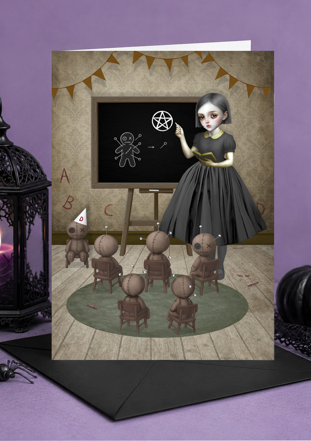Pop surrealism gothic girl card  of girl teaching a classroom of small voodoo dolls at a blackboard drawing pentagrams.