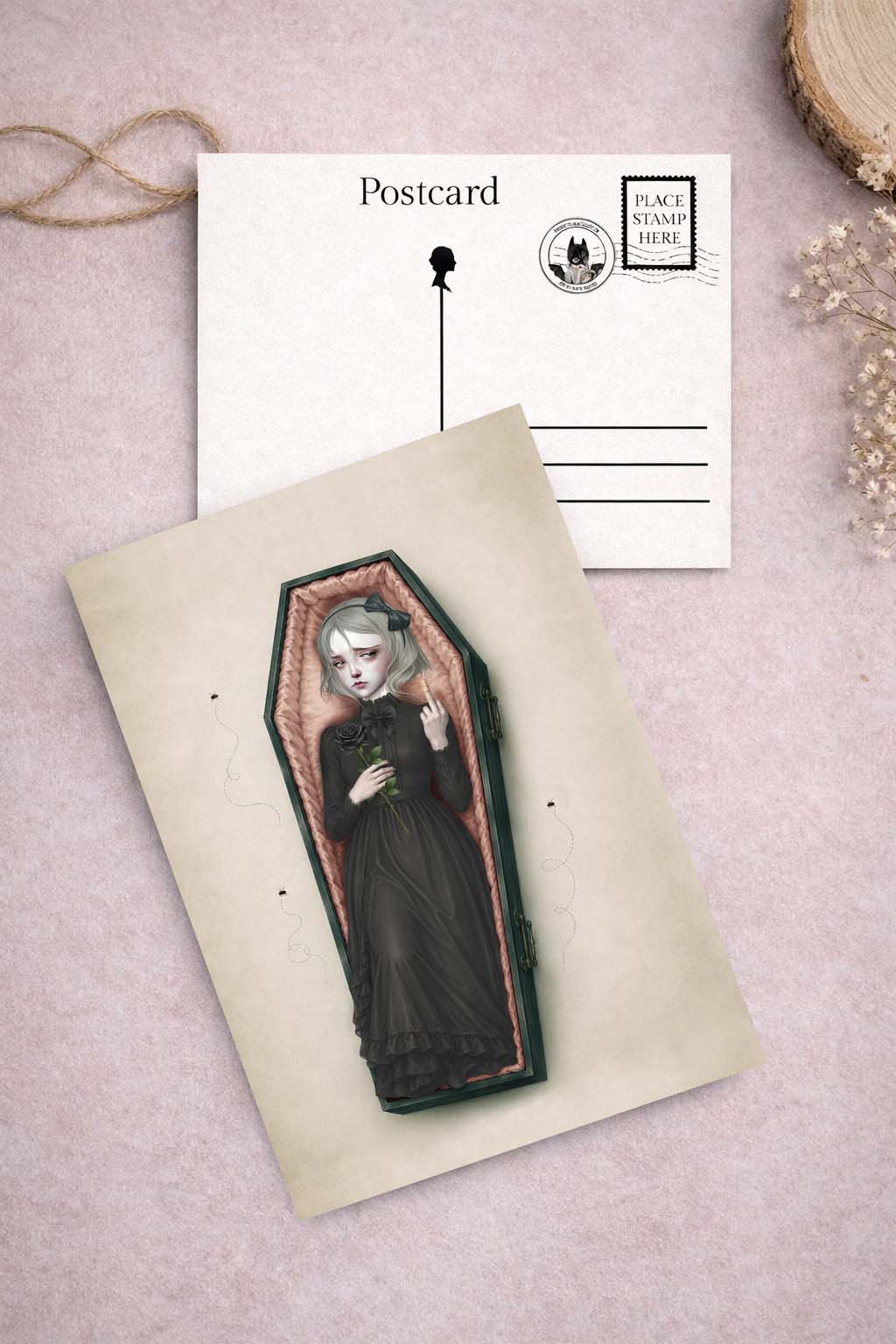 Postcard with a design of a Victorian woman in a coffin with a wounded on a textured surface.