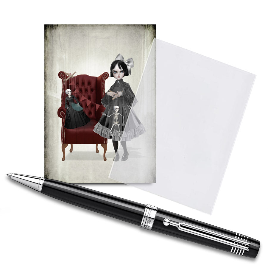 The ACEO card features a victorian girl and her creepy skeleton marionette dolls, displayed in a clear protective sleeve with a pen for size comparison. It showcases creepy, gothic artwork.