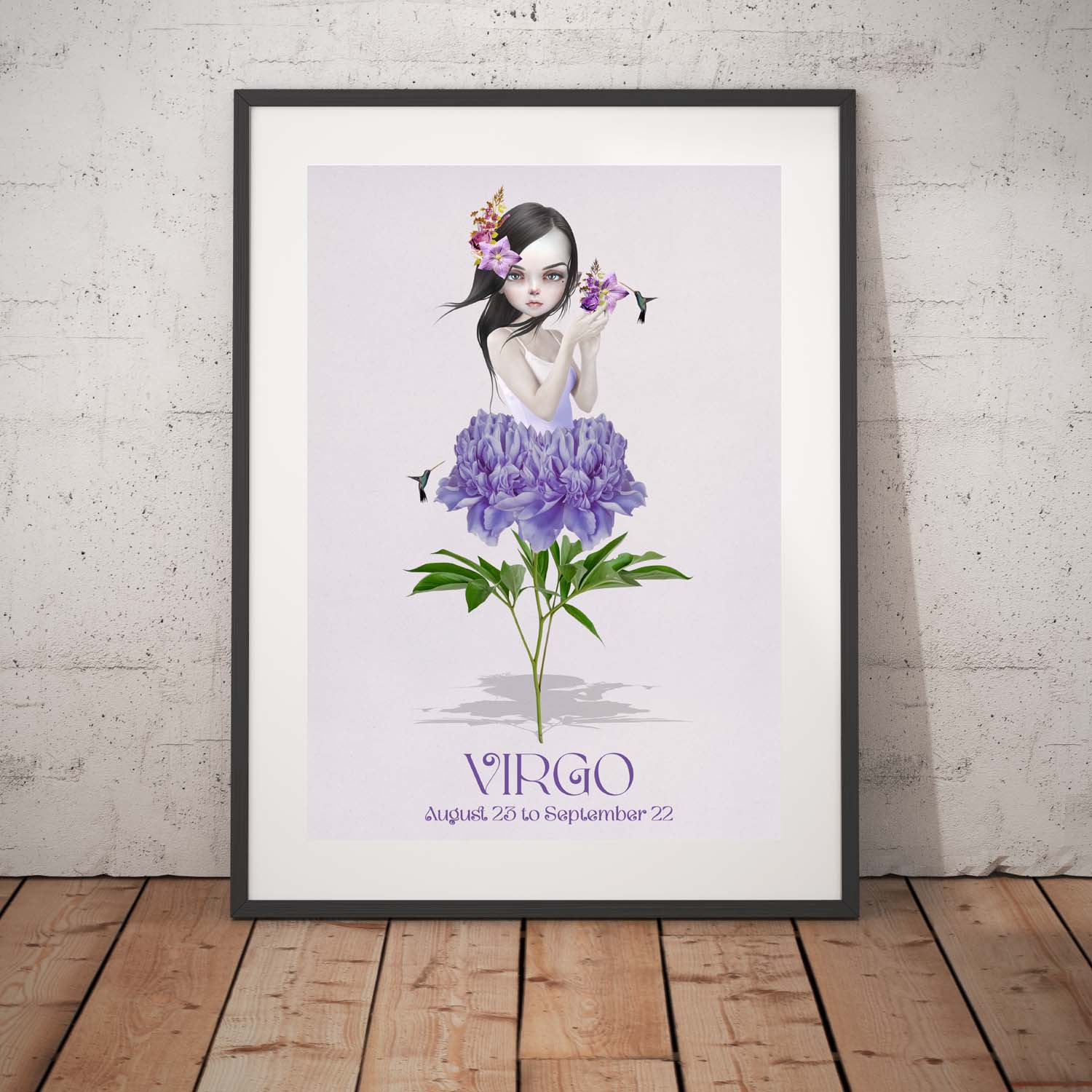 Female virgo art print in a black frame, standing against a white wall.