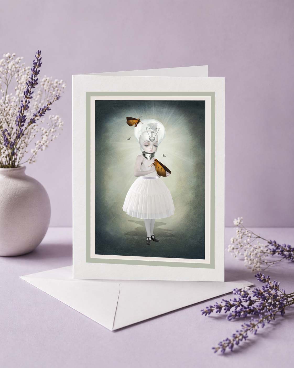 Whimsical art greeting card featuring a surreal moth girl with a light bulb head. High-quality blank note card perfect for dark fantasy & creepy cute stationery lovers.