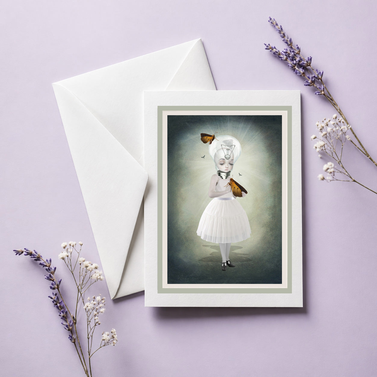 Art Greeting Card featuring a surreal moth girl with a light bulb head. Card comes with white envelope.