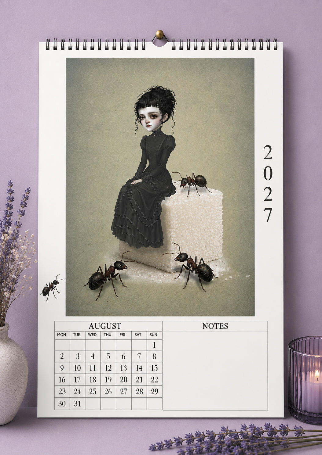 Open view of the August page in the 2027 Whispers and Willow calendar, displaying a dark whimsical illustration of a girl in a black dress sitting on a sugar cube with giant ants alongside a monthly grid and notes section.