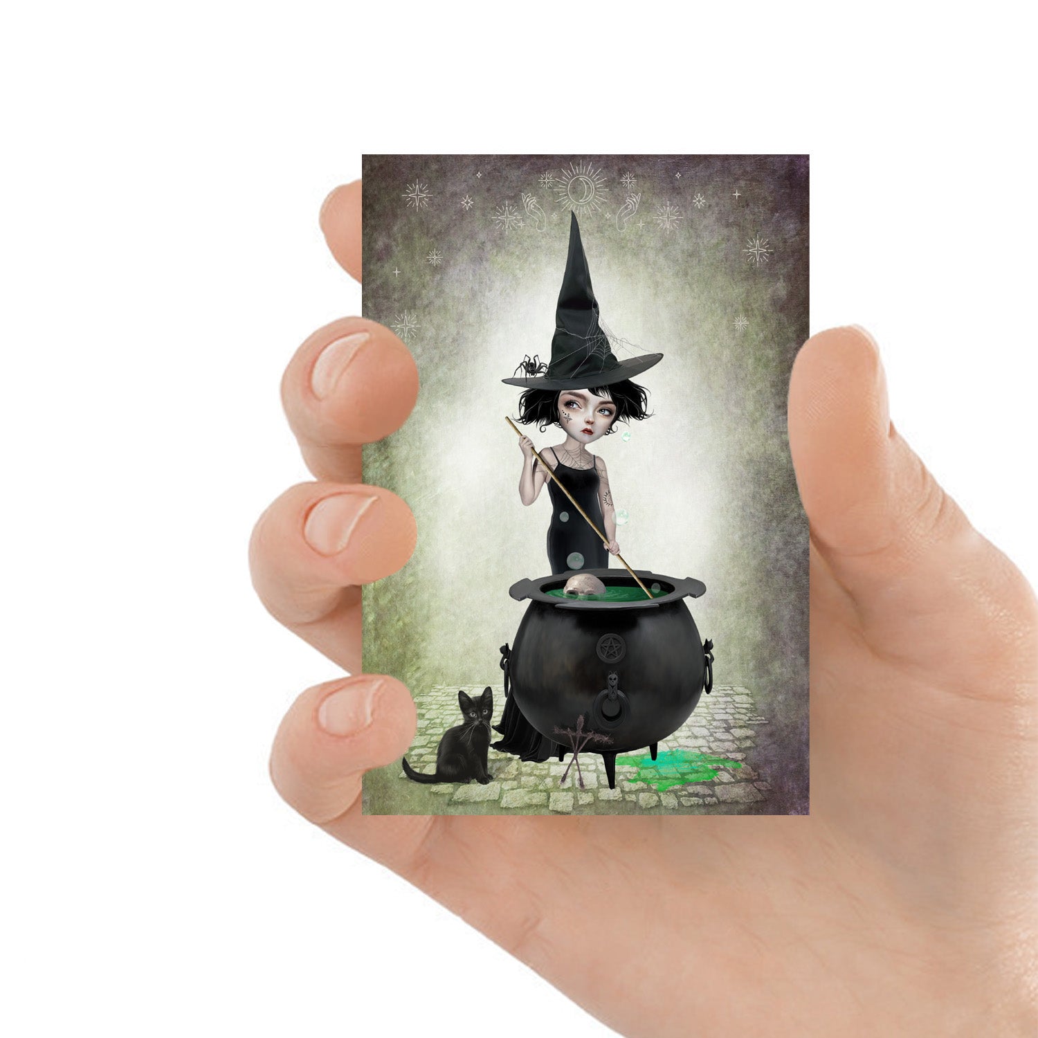 Witchy ACEO artist trading card features a witch stirring her cauldron while her cat keeps her company.