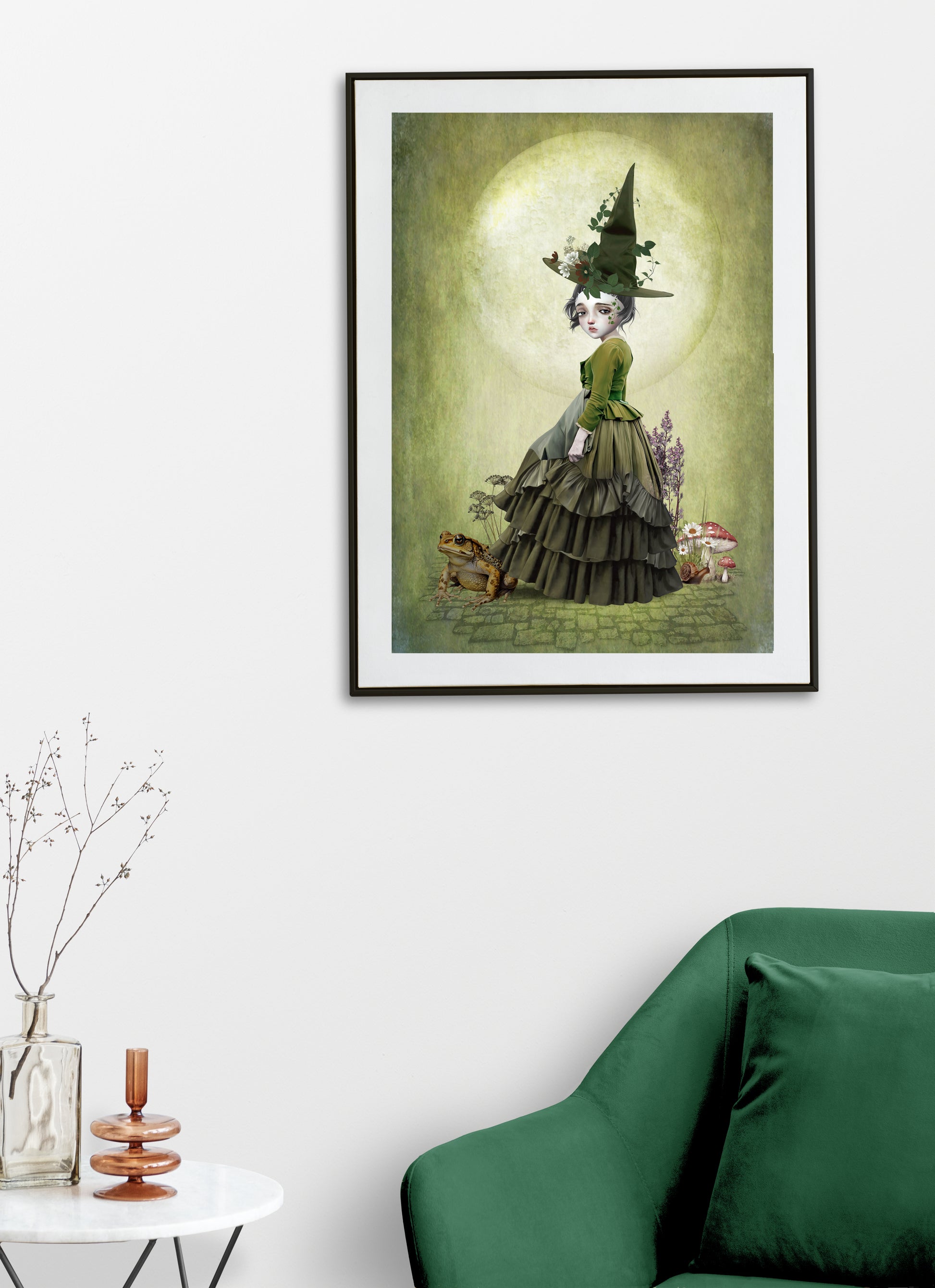 Framed Witch and Toad Art print hanging on a living room wall.