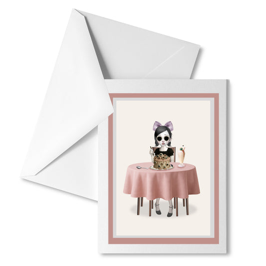 Surreal greeting card with envelope – eyeless girl and eyeball cake design.