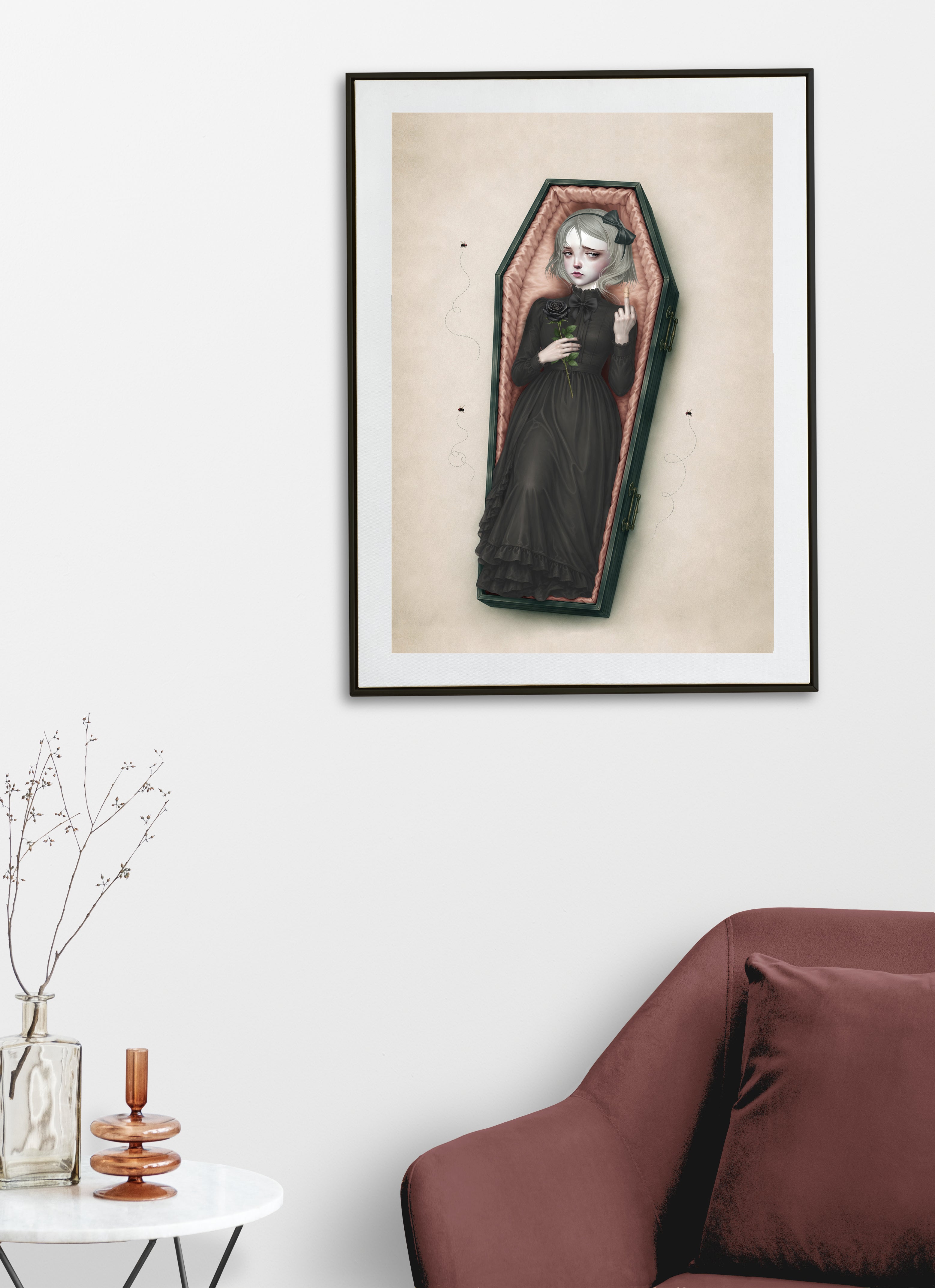 This gothic coffin girl art print displayed on a living room wall blends dark whimsy with surreal style—perfect for your alternative home decor. 