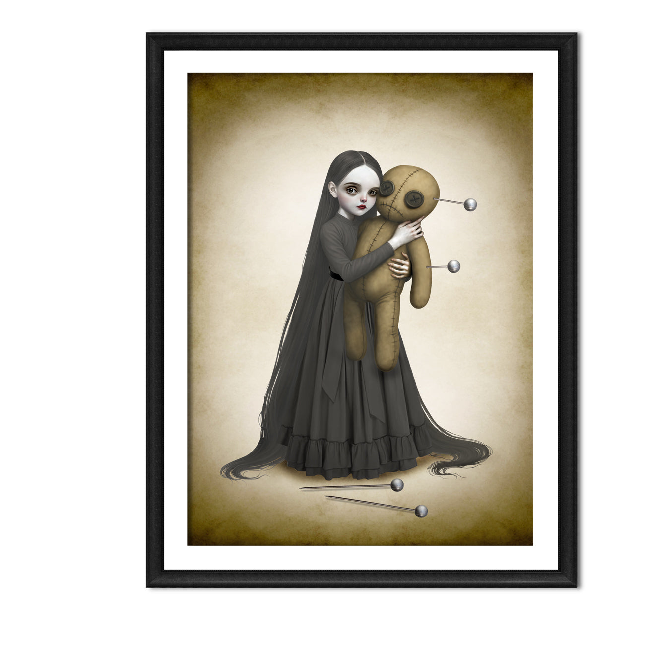 Black framed voodoo doll art print hung on a white wall, showcasing the eerie illustration of a gothic girl and her stitched doll