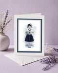 Art greeting card of sailor girl holding a fishbowl with a miniature shark.