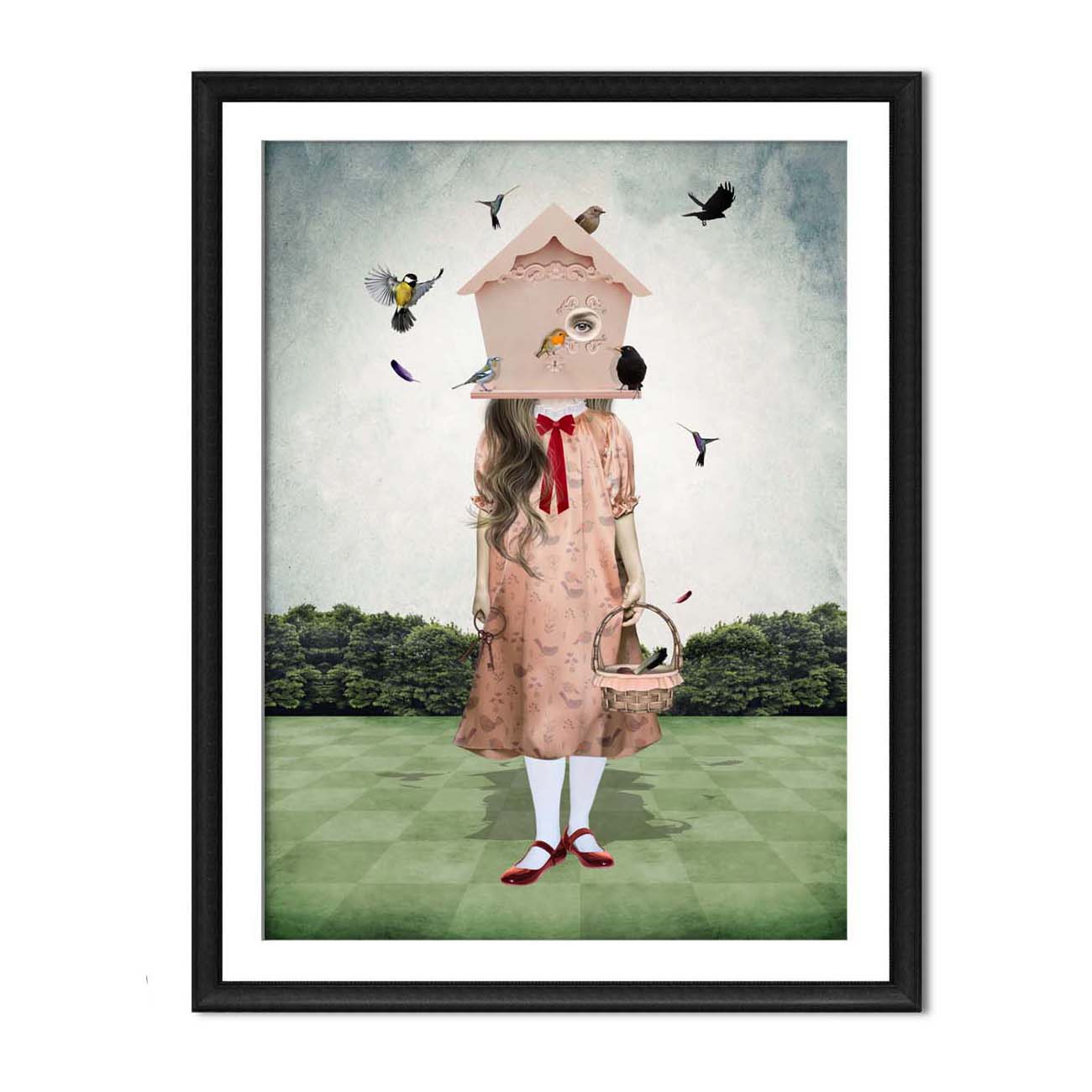 The Surreal Birdhouse Girl art print in a black frame hanging on a white wall.