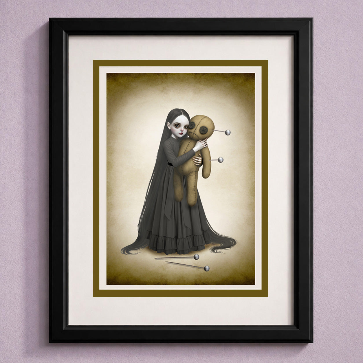 Framed art greeting card of a of a goth girl in a black dress holding an oversized voodoo doll against a beige background.